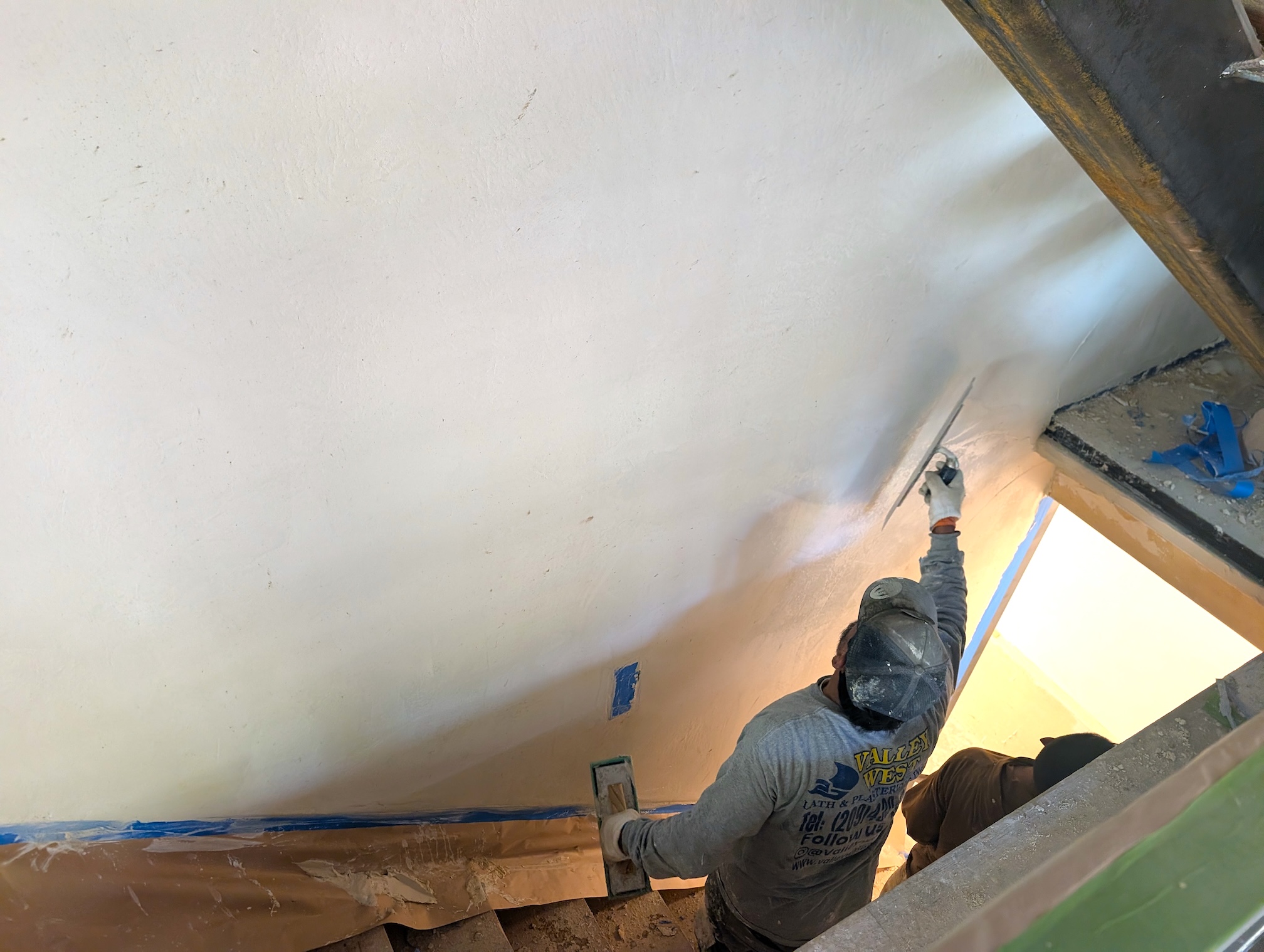 HempRock certified plaster artisan applying finish coat on home wall